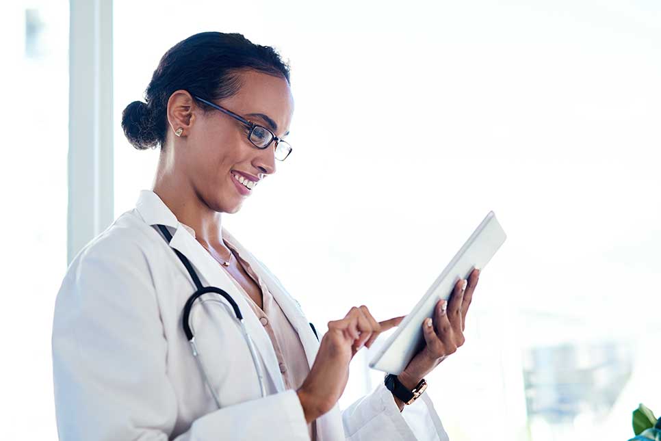 Doctor selecting a publication from a smartphone